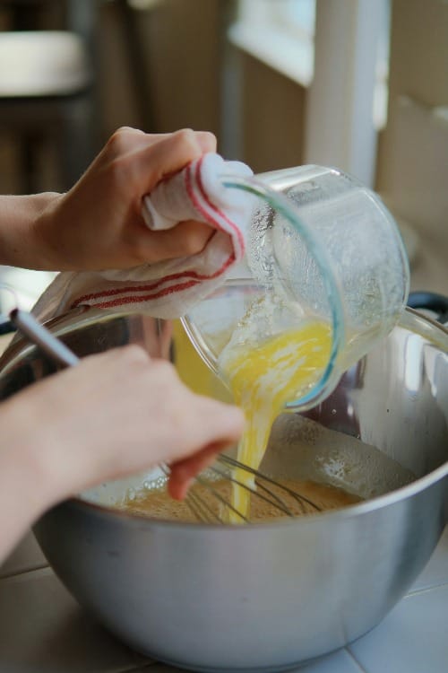 a person is mixing something in a pot
